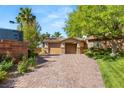 Beautiful home featuring a brick driveway leading to a three-car garage at 2285 Villefort Ct, Las Vegas, NV 89117