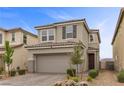 Charming two-story home with a well-manicured front yard and an attached two-car garage at 2293 Teatro Ave, Henderson, NV 89044