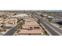 Aerial view of a neighborhood with solar panels and easy access to the city and major streets at 7137 Flowering Rose Ave, Las Vegas, NV 89117