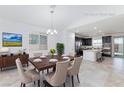 Virtually staged dining room with modern table, chairs, and stylish decor at 7137 Flowering Rose Ave, Las Vegas, NV 89117