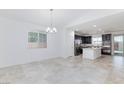 Bright kitchen featuring modern appliances, granite countertops, and a center island at 7137 Flowering Rose Ave, Las Vegas, NV 89117