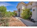 Well-kept home showcasing beautiful landscaping and a welcoming front entrance, perfect for any homeowner at 90 Ancient Hills Ln, Henderson, NV 89074