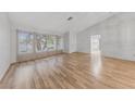 Bright open floorplan with wood floors, natural light and access to the kitchen at 9917 Arbuckle Dr, Las Vegas, NV 89134