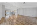 Open living room featuring wood floors and a decorative chandelier at 9917 Arbuckle Dr, Las Vegas, NV 89134