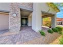 Charming front porch with stone accents and a neatly paved entryway at 109 Reverie Heights Ave, Henderson, NV 89011