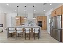 Modern open-concept kitchen with a large island, stainless appliances, and ample counter space at 2317 Sierra Heights Dr, Las Vegas, NV 89134