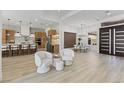 Bright, spacious living area with modern design, open to dining and kitchen at 2317 Sierra Heights Dr, Las Vegas, NV 89134