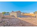 Fenced backyard features low-maintenance landscaping, offering a private outdoor space at 2708 Bello Dr, North Las Vegas, NV 89030