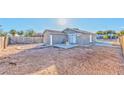 View of the backyard featuring low maintenance ground cover and a small patio at 2708 Bello Dr, North Las Vegas, NV 89030