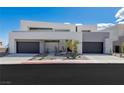 Contemporary home showcases a clean facade, two-car garage, modern landscaping, and sleek architectural design at 29 Falling Ridge Ln, Henderson, NV 89011