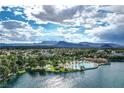 Scenic aerial view of a lakeside community featuring lush greenery and a sandy beach area at 3151 Soaring Gulls Dr # 2035, Las Vegas, NV 89128