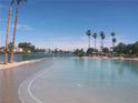 Beautiful community lagoon style pool and tropical landscaping create a resort style living environment at 3151 Soaring Gulls Dr # 2035, Las Vegas, NV 89128