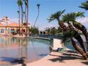 Lake Las Vegas community pool and beach with palm trees in Henderson, Nevada at 3151 Soaring Gulls Dr # 2035, Las Vegas, NV 89128