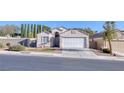 Charming single-story home featuring a two-car garage and beautifully landscaped front yard at 3197 Castle Canyon Ave, Henderson, NV 89052