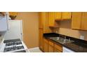Functional kitchen featuring essential appliances and a double sink for convenience at 3318 N Decatur Blvd # 1002, Las Vegas, NV 89130