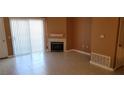Comfortable living room features tile flooring, fireplace, and sliding glass doors at 3318 N Decatur Blvd # 1002, Las Vegas, NV 89130