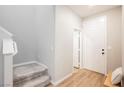 Inviting entryway with hardwood floors, staircase, and stylish front door at 3525 Serravalle Ln, Henderson, NV 89044