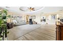 Bright living room featuring a decorative ceiling, tile floors, and a spacious layout for entertaining at 439 Cannes St, Henderson, NV 89015