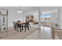 Bright, open-concept dining area with view of the living room and kitchen at 45 Via Di Mello, Henderson, NV 89011