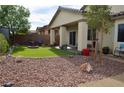 Backyard oasis featuring a well-manicured lawn, a fire pit, and plenty of room for outdoor enjoyment at 4770 Lorenzo Way, Pahrump, NV 89061