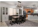 Bright dining area featuring stylish lighting and convenient access to the kitchen at 6973 Pacific Coast St, Las Vegas, NV 89148