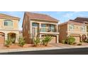 Beautiful home showcasing a red tile roof, balcony, two-car garage, and manicured landscaping at 8276 Sorrel St, Las Vegas, NV 89139