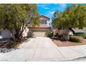 Charming two-story home featuring a well-maintained front yard and an attached two-car garage at 844 Binbrook Dr, Henderson, NV 89052