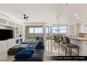 Bright open-concept living room with dining area, marble floors, and city skyline views at 9101 Alta Dr # 706, Las Vegas, NV 89145