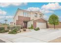 Charming two-story home with landscaped yard, brick accents, and a spacious driveway at 9373 Oxbow Lake Ave, Las Vegas, NV 89149