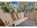 Enclosed patio with brick walls and a gate, offering privacy and outdoor space at 9655 Lame Horse Dr, Las Vegas, NV 89123