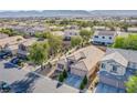 A beautiful shot of the neighborhood, showcasing the well-kept yards and the sense of community at 9831 Running Rabbit St, Las Vegas, NV 89143