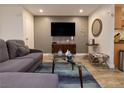 A cozy living room with a sectional sofa, TV, and stylish decor at 1553 Dorothy Ave # 4, Las Vegas, NV 89119