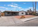 Charming single-story home featuring a well-manicured front yard and ample parking space in the driveway at 1808 E Saint Louis Ave, Las Vegas, NV 89104