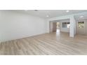 Spacious living room with light wood flooring, neutral color scheme, and natural light at 1808 E Saint Louis Ave, Las Vegas, NV 89104