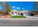 Charming single-story home featuring a desert landscaped yard and a neutral color palette at 2528 Sunup Dr, Las Vegas, NV 89134