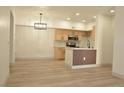 Modern kitchen area with light wood cabinets and stainless steel appliances at 2615 W Gary Ave # 1015, Las Vegas, NV 89123