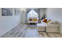 Bright, airy living room features a neutral color palette, comfortable seating, and stylish decor at 3930 University Center Dr # 409, Las Vegas, NV 89119
