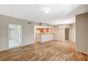 Open-concept living space with a kitchen bar and stylish flooring at 50 Aura De Blanco St # 19103, Henderson, NV 89074