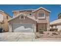 Two story home featuring a tile roof and attached two-car garage at 5921 Royal Castle Ln, Las Vegas, NV 89130