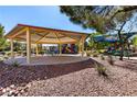 Inviting covered picnic area next to a playground, perfect for outdoor gatherings and Gathering fun at 7237 Puddle Duck St, Las Vegas, NV 89166