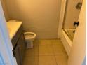 Bathroom featuring a vanity with sink, toilet, and a tiled shower and tub at 805 Slayton Dr, Las Vegas, NV 89107