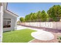 Private backyard with artificial turf and a block wall ensuring maximum privacy at 9813 Folsom Dr, Las Vegas, NV 89134