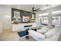 Comfortable living room featuring a modern entertainment center and view to outdoor living space at 9813 Folsom Dr, Las Vegas, NV 89134