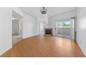 Bright living room boasts hardwood floors, fireplace, and sliding door access to the outdoor space at 10116 Jacob Pl # 104, Las Vegas, NV 89144