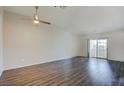 Spacious living room with modern ceiling fan and sliding glass doors to the outside at 1979 Cutlass Dr # 1979, Henderson, NV 89014