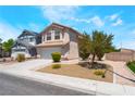 Beautiful desert landscaped home featuring a two-car garage, and desert landscaping at 4708 Grand Rock Dr, North Las Vegas, NV 89081