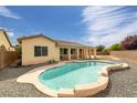 Backyard featuring a sparkling swimming pool, covered patio, and plenty of space for outdoor activities at 5300 E La Terra Ave, Pahrump, NV 89061
