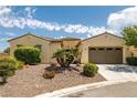 Charming single-story home with a two-car garage, desert landscaping and mature shrubbery in the front yard at 5300 E La Terra Ave, Pahrump, NV 89061