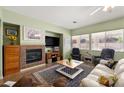 Inviting living room with a cozy fireplace, comfortable seating, and lots of natural light at 5300 E La Terra Ave, Pahrump, NV 89061