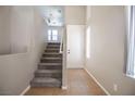 View of the carpeted staircase leading to the upper level of the house at 6652 Weeping Pine St, Las Vegas, NV 89149